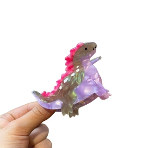 Bunte Haarklammer aus Acetat in Dinosaurierform mit Marmortextur für stilvolle Frisuren