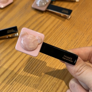 Pink acetate hair clip with marble pattern bear design and handmade lettering