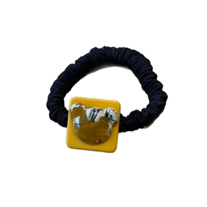 Cute bear hair scrunchie with yellow marble resin ornament on black pleated fabric
