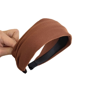 Minimalist wide brown fabric headband with matte texture and non-slip lining for women