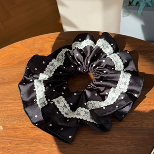 Lace-trimmed black polka dot satin scrunchie with a handmade pastoral aesthetic