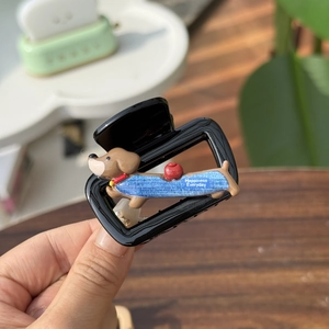 Detail of square hair claw clip with cartoon dachshund dog and happiness quote
