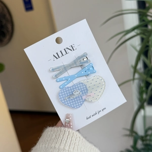 Three-piece hair clip set featuring light blue plaid, polka dots, and heart-shaped designs
