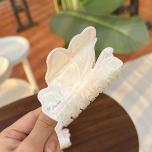 Floral butterfly hair claw clip in pearl white with pink accents and rhinestone detail