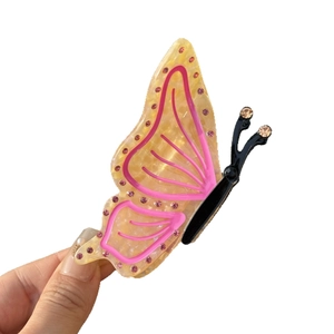 Elegante pinza per capelli a farfalla ambra con strass rosa e finitura in acetato