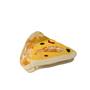 Creative pizza slice hair claw clip made of glossy yellow acetate with food toppings