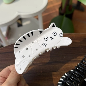 Cute white cat hair claw clip with black details and sparkling rhinestones for women