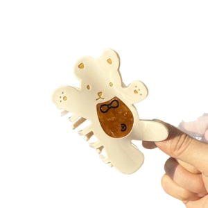 Pince à cheveux ours crème avec nœud marron et paillettes dorées en acétate
