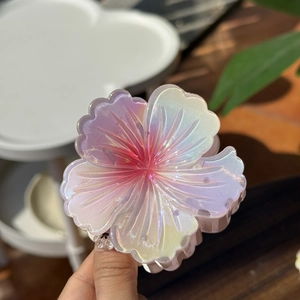 Iridescent laser flower hair claw clip with colorful resin petals for high ponytail styles