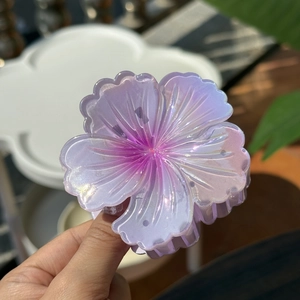 Laser flower claw clip in iridescent purple pink gradient for high ponytail styling