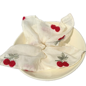 Elegant white embroidered cherry scrunchie with lace details in Korean style for women