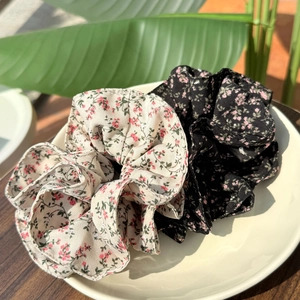French vintage floral scrunchie set including beige and black patterns on ceramic plate