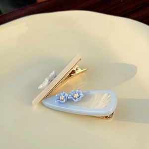 Elegant teardrop hair clip set with acetate flowers in blue and beige tones