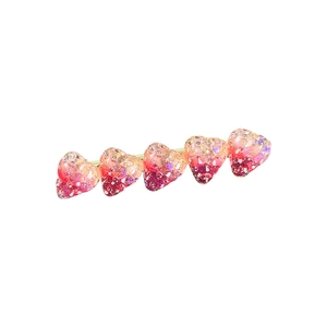 Süße Haarspange mit rosa Herz-Verlauf und goldener Metallbasis im Wellendesign