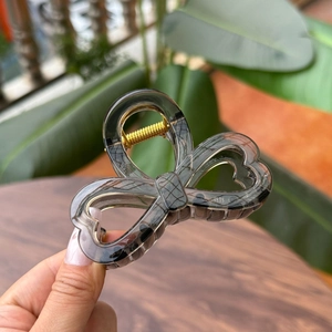 Elegant 8cm smoky grey bow hair claw clip with heart cutouts and gold spring mechanism