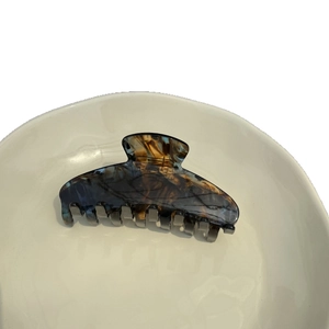 Elegant tortoise shell acetate hair claw clip with semi-transparent amber marble texture