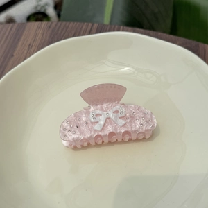 Pink glitter acrylic hair claw clip with white bow and rhinestones in a sweet Korean style