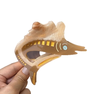 Sweet acetate fish hair claw clip with brown tortoiseshell pattern and golden sparkles