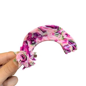 Floral acetate hair claw clip with pink rose detail and colorful marble pattern finish