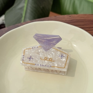 Elegant white marble acetate hair claw clip with purple diamond accent and rhinestones