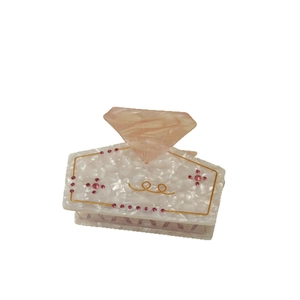 Elegant white marble acetate hair claw clip with pink diamond crystal and gold accents