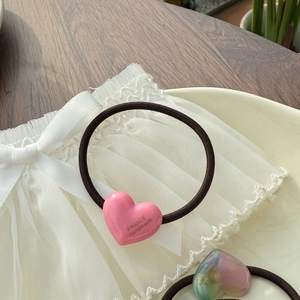 Pink heart resin hair tie with France Handmade text on elegant white lace background