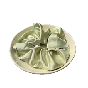 French style light green satin silk scrunchie with elastic pleats and logo tag