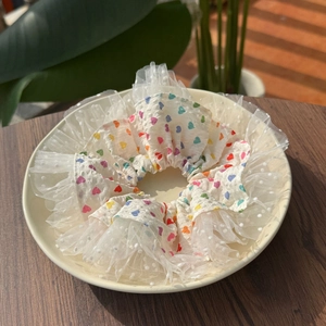 Sweet white scrunchie with colorful heart print and dotted lace trim for hair