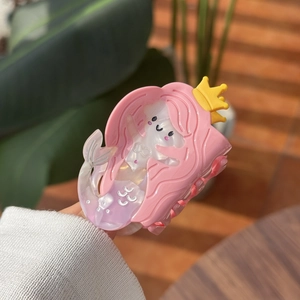 Charming pink mermaid hair claw clip with shell texture and crown detail for women