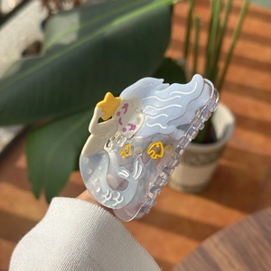 Cute acetate mermaid hair claw clip with yellow stars and fish patterns in light blue