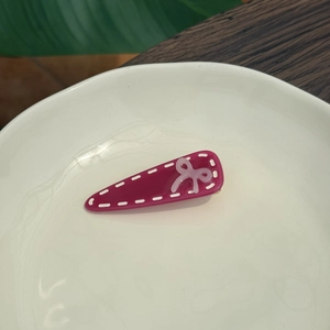 Sweet rose red acetate triangle hair clip with white edge and pale pink bow detail