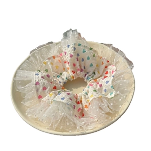 White lace scrunchie with colorful heart patterns and polka dot mesh edges for women