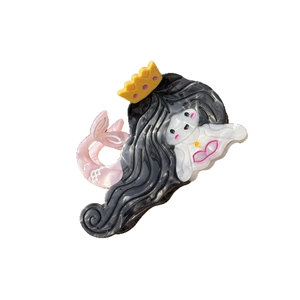 Cute acetate mermaid hair claw clip with pearlescent pink tail and yellow crown detail