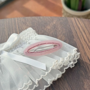 Pink translucent oval hair clip with sparkling rhinestones and Creation France engraving
