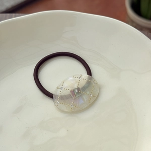 Elegant cellulose acetate hair tie with grid patterns and sparkling rhinestones