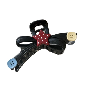 Cute black resin bow hair claw clip with star button and wave stripe pattern
