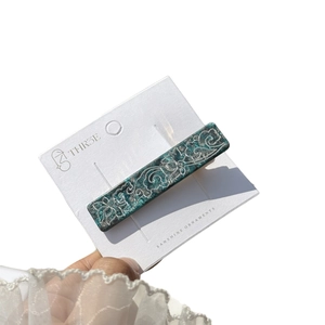 Elegant green marble duckbill clip with silver cloud floral patterns on display card