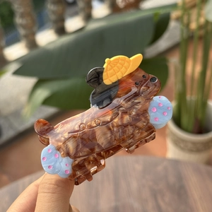 Cute acetate dog hair claw clip with detective hat and blue polka dots design