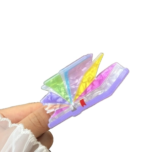 Creative book-shaped acrylic hair claw clip with colorful layered design for high ponytail