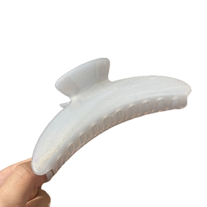 Pearlescent white crescent hair claw clip with silver glitter finish for women