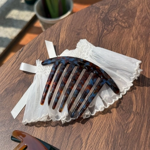 Elegant tortoiseshell acetate hair comb with floral patterns and France Handmade gold text