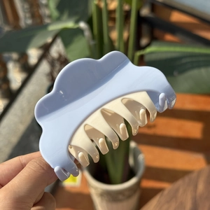 Blue and cream cloud shaped hair claw clip in a glossy finish for stylish hair styling