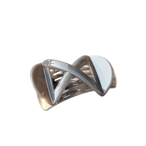 Elegant geometric X-shaped hair claw clip in contrast grey and cream white resin finish