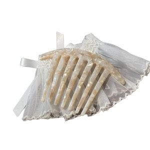 Handmade marble texture acetate hair comb with golden France lettering for elegant styling
