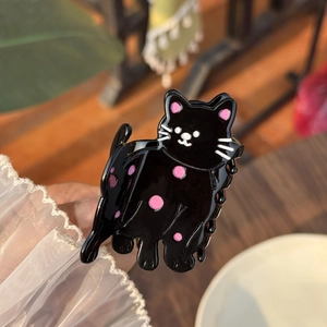 Pince à cheveux chat noir en acétate avec pois roses pour coiffures queue de cheval chic