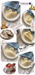 Macro view of cream hair clips in various shapes like heart, triangle and rectangle