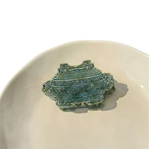 Acetate hair claw clip with ancient Chinese bronze Ding vessel patterns in green