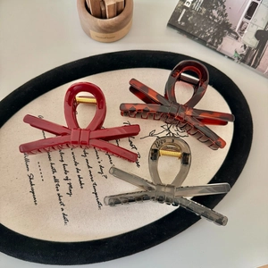 Set di tre pinze per capelli a fiocco nei colori rosso, tartarugato e grigio trasparente