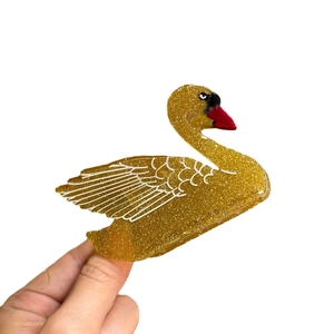 Molla per capelli a forma di cigno dorato con glitter e profili bianchi eleganti