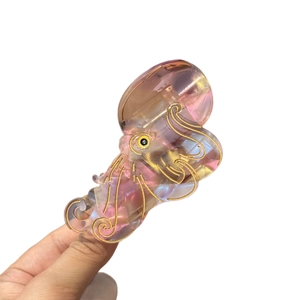 Artistic octopus hair claw clip made of iridescent acetate with gold detail accents